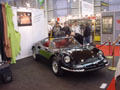 Mr. Stefan Urfer devant la Ferrari Dino de son stand