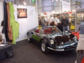 Mr. Stefan Urfer devant la Ferrari Dino de son stand